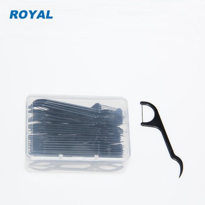 charcoal floss picks in dental floss box